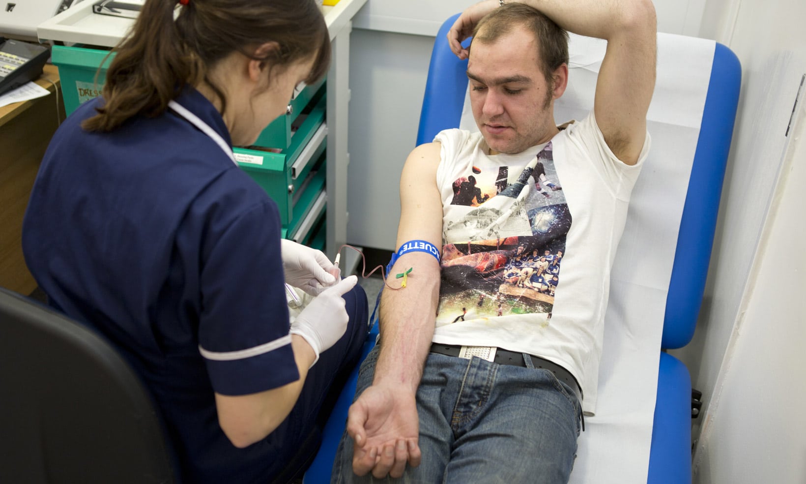 Taking blood from a homeless man